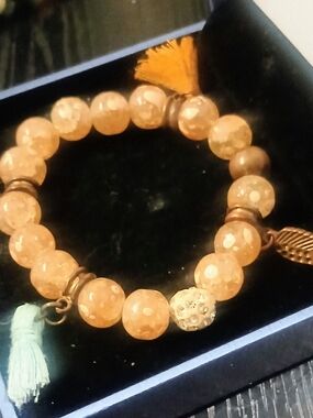 Peach Bead Stretch Bracelet with Tassels and Leaf Charm